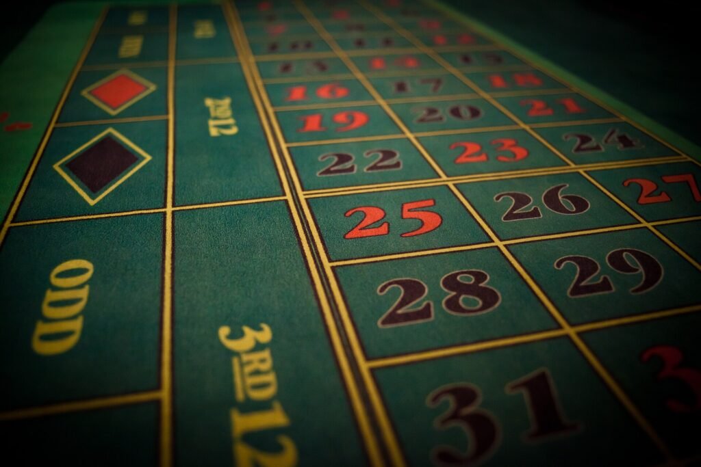 Close-up of a green roulette table layout showing numbers 16 to 31, the odd box, the third dozen box and the red and black diamonds